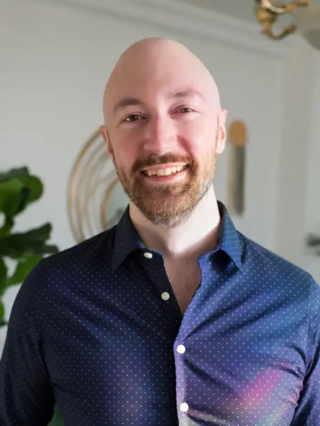 Matt Hinsz smiling in a blue shirt
